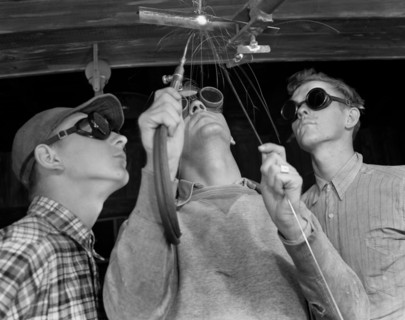 Instructor Training Two Young Men to Weld Aircraft at Vocational School as part of Program to Provide more Workers for War Production for Florida's Pooling Program, De Land, Florida, USA, Howard R. Ho...