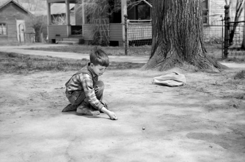 Boy Shooting Marbles, Woodbine, Iowa, USA, John Vachon for Farm Security Administration, May 1940