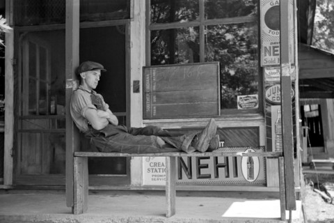 Man Resting in front of General Store, Blankenship, Martin County, Indiana, USA, Arthur Rothstein for U.S. Resettlement Administration, May 1938