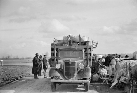 State Highway Officials Moving Evicted Sharecroppers Away from Roadside to Area between Levee and Mississippi River, New Madrid County, Missouri, USA, Arthur Rothstein for Farm Security Administration...