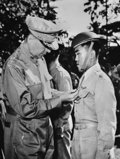U.S. General Douglas MacArthur (left) Pinning Distinguished Service Cross on Captain Jesus A. Villamor of the Philippine Air Force for Heroism in the Air, Manila, Philippines, Office of War Informatio...