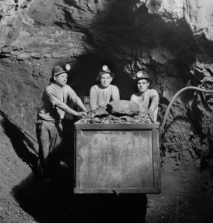 Three Miners Loading Mercury Ore into Mine Car by Hand, Quicksilver Mining Company, New Idria, California, USA, Andreas Feininger for Office of War Information, December 1942