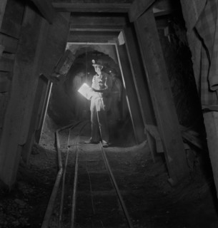 Worker Inspecting New Timbering in Mining Tunnel, Quicksilver Mining Company, New Idria, California, USA, Andreas Feininger for Office of War Information, December 1942