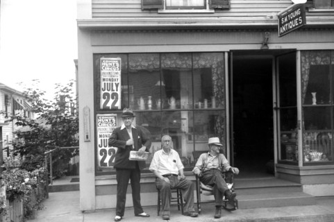 Three Men Relaxing in front of Antiques Shop, Provincetown, Massachusetts, USA, Edwin Rosskam for Farm Security Administration, August 1940