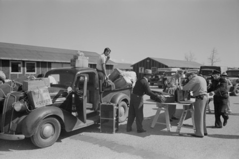 Baggage of Japanese-Americans being Inspected as they Arrive from West Coast Areas under U.S. Army war emergency order, Reception Center, Santa Anita, California, USA, Russell Lee, Office of War Infor...