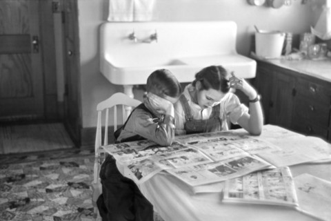 Children Reading Sunday Newspaper, Family of Tenant Farmer, Dickens, Iowa, USA, Russell Lee, U.S. Resettlement Administration, December 1936