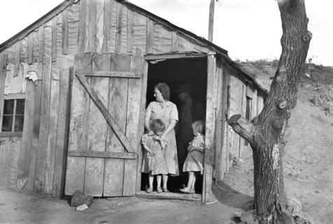 Earl Pauley Family, Tenant Farmers, in Doorway of Farmhouse, near Smithland, Iowa, USA, Russell Lee, U.S. Resettlement Administration, December 1936