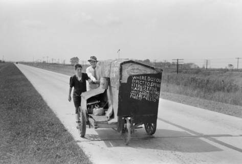 Traveling Evangelists Pushing Cart on Road between Lafayette and Scott, Louisiana, USA, Russell Lee, Farm Security Administration, October 1938