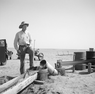 Farmer Pumping Water from Well to Parched Fields during Drought, Cimarron County, Oklahoma, USA, Arthur Rothstein, Farm Security Administration, April 1936