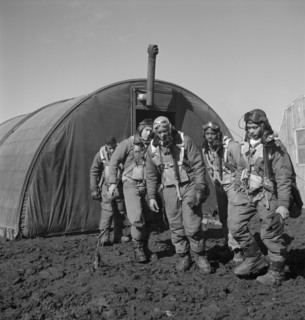 Tuskegee Airmen Leaving Parachute Room, Left to right: Richard S. Harder, Brooklyn, NY, Class 44-B; Unidentified Airman; Thurston L. Gaines, Jr., Freeport, NY, Class 44-G; Newman C. Golden, Cincinnati...