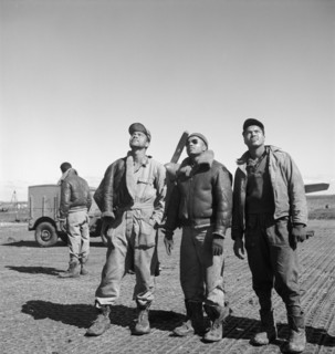 Three Tuskegee Airmen looking Up at Air Base, Ramitelli, Italy, Toni Frissell, March 1945