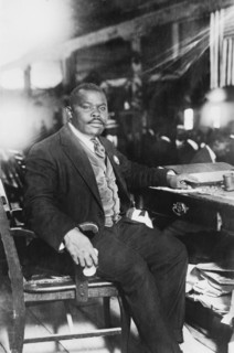 Marcus Garvey (1887-1940), Jamaican-Born Activist, Political Leader, Publisher, Entrepreneur and Proponent of Black Nationalism and Pan-Africanism Movements, Full-length Portrait seated at Desk, Bain ...
