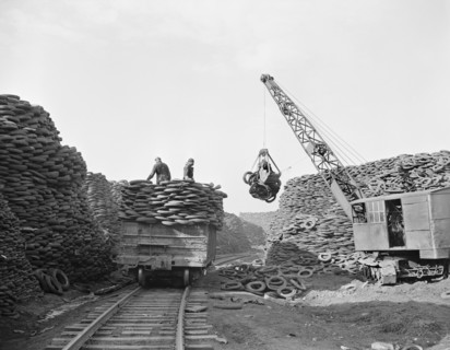 Workers Stacking Discarded Tire Casings at Recovery Plant with the Reclaimed Material to be Manufactured into Thousands of Essential Mechanical Rubber Products, Firestone Tire and Rubber Company, Akro...