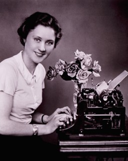 Smiling Woman Typing on Typewriter, circa 1930's