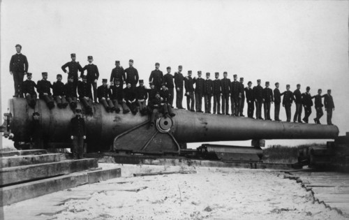 Group of Men Sitting on Barrel of Large Railroad Gun, WWI, circa 1910's