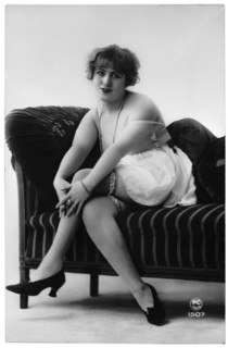 French Lingerie Model Seated on Chaise Lounge, Hands on Knees, circa 1920