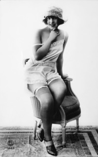 French Lingerie Model Sitting on Arm of Chair, 1920