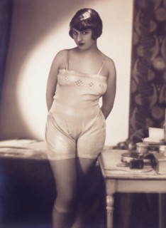 French Lingerie Model Standing Next to Bed, 1915
