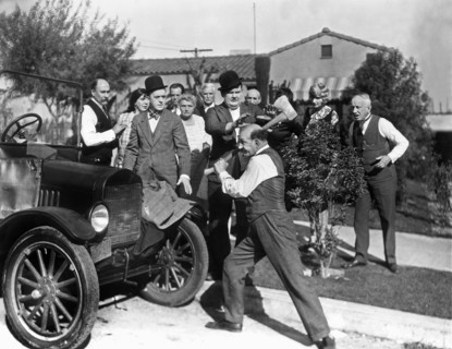 Stan Laurel, Oliver Hardy and James Finlayson on-set of the Film, Big Business, 1929