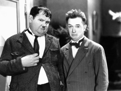 Oliver Hardy and Stan Laurel on-set of the Film, One Good Turn, 1931