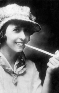 Mistinguett, French Actress and Singer, Smoking a Pipe, circa 1910's