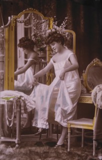 Lingerie Model Standing Near Mirror, circa 1920