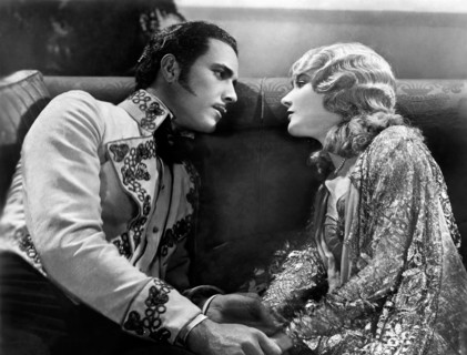 Don Alvarado, Mary Philbin, on-set of the Silent Film, "Drums of Love", 1928