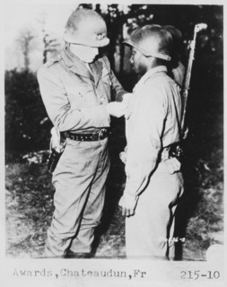 Lt. General George S. Patton Pins Silver Star on Private Ernest A. Jenkin after Liberation of Chateaudun, France, Oct. 13, 1944