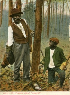 African-American Man and Boy with Snared Opossum, Series 13931, "De 'Possum Hunt - Caught", USA, Hand-Colored Postcard, circa 1910