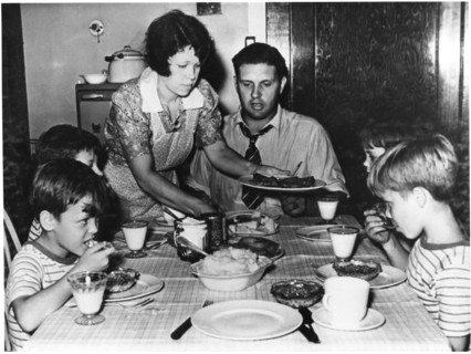 Woman Serving Family Dinner, circa 1955, from the Documentary Film, "Emerging Woman", Women's Film Project, 1974