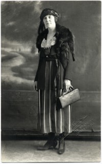 Woman in Striped Dress, Hat and Fur Shawl Holding  Handbag, Portrait, circa 1910