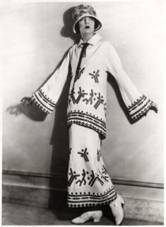 Fashionable Woman in Two-Piece Outfit of White Twill, Applique Motifs and Embroidery with Hat, Portrait, circa 1922