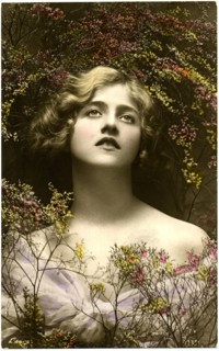 Woman in Pale Purple Dress Looking Up, Surrounded by Tiny Flowers, Hand-Colored Postcard, circa 1910's
