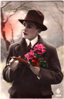 Woman Dressed in Man' Coat and Hat Holding Flowers and Card, "Bonne France", Hand-Colored French Postcard, circa 1927