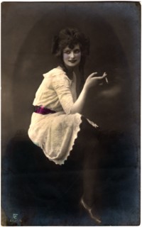 Seated Woman in White Dress and Red Sash Smoking Cigarette, Hand-Colored Postcard, Germany, circa 1920's