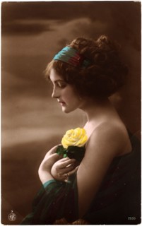 Woman in Green Dress and Headband Holding Yellow Rose against Chest, Profile, Hand-Colored Postcard. Circa 1920's
