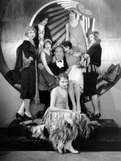 Mack Swain, surrounded by Chorus Girls, on-set of the Silent Film, "Becky", 1927