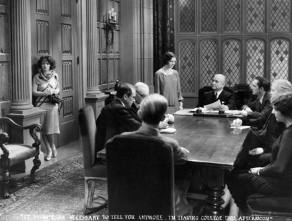 Clara Bow, (left), Shirley O'Hara, Fredric March, (seated, right), on-set of the Film "The Wild Party", 1929