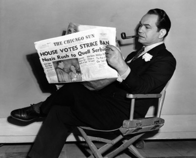 Edward G. Robinson, Portrait Reading Newspaper, circa 1943