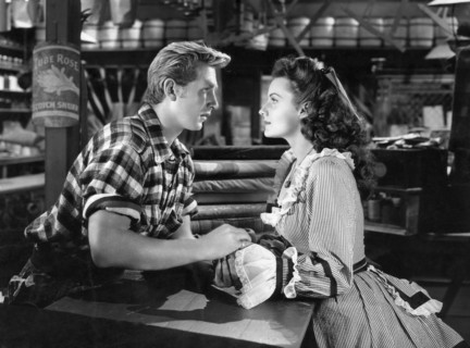 Lloyd Bridges, Rhonda Fleming, on-set of the Film "Abilene Town", 1946