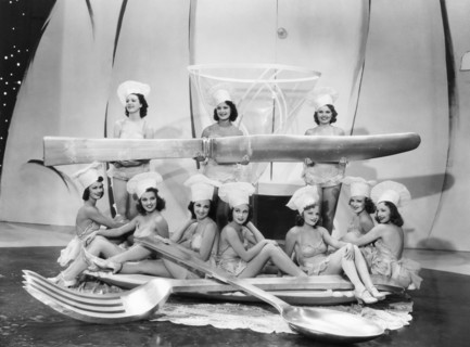 Chorus Girls with Large Spoon, Fork & Knife, on-set of the Film "Merry-Go-Round of 1938", 1937
