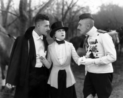 John Gilbert, (left), Mae Murray, on-set of the Silent Film "The Merry Widow", 1925