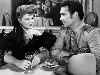 Claire Trevor, Barry Sullivan, on-set of the Film "The Woman of the Town", 1943