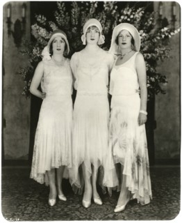 Portrait of Three Unidentified Actress in Fashionable Long Dresses with Uneven Hemlines, circa 1925