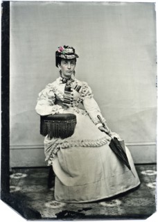 Portrait of Seated Adult Woman Wearing Hat and Holding Parasol, Hand-Colored Tintype, circa 1870