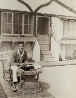 Norman Foster, Typing in front of his Beach Cottage, Publicity Portrait for the Film, "Orient Express", Fox Film Corp., 1934