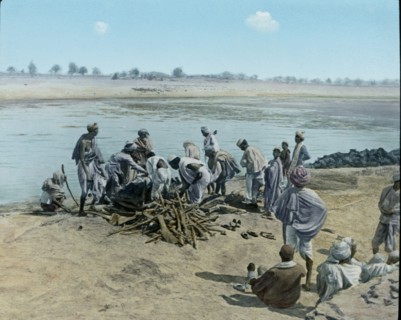 Corpse on Pyre, Hindu Funeral, Lower Ganges, Uttar Pradesh, India, Hand-Colored Magic Lantern Slide, Newton & Company, 1930
