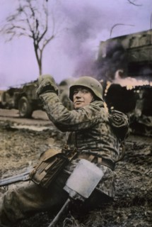 German Soldier Waving Members of his Unit Forward, Ardennes-Alsace Campaign, Battle of the Bulge, 1945