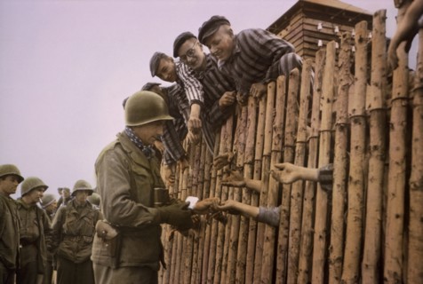 Enlisted Man of Seventh US Army Giving Cigarettes to Liberated Prisoners, Dachau, Germany, Central Europe Campaign, Western Allied Invasion of Germany, April 29,1945