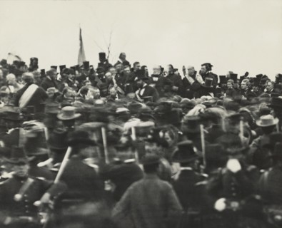 U.S. President Abraham Lincoln (without Hat below Flag slightly right) Standing Amongst Crowd during Dedication of Soldier's National Cemetery where he Delivered his Famous Speech, the Gettysburg Addr...